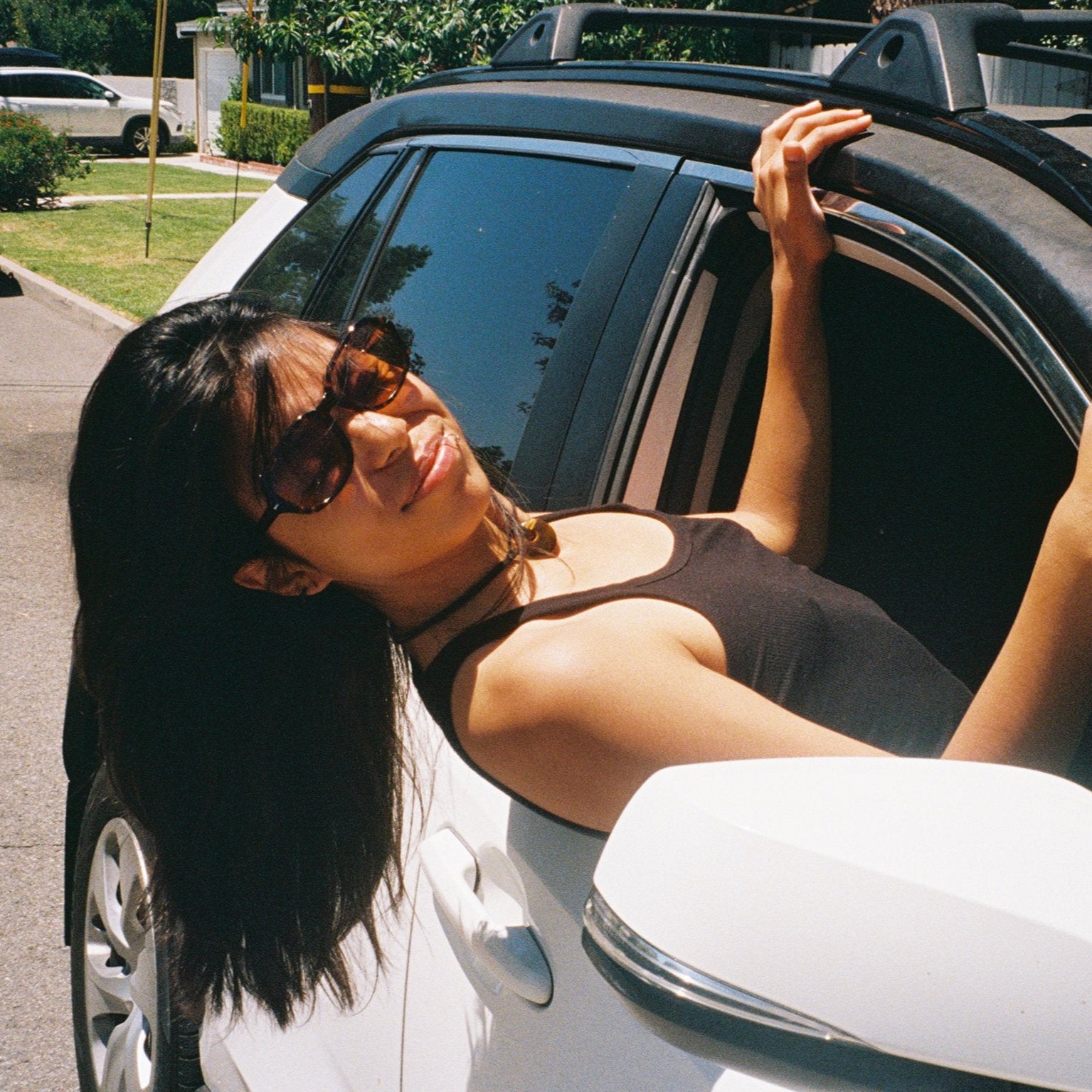 Woman wearing SAD Eyewear Dusk premium square sunglasses in tortoiseshell with UV protection lenses