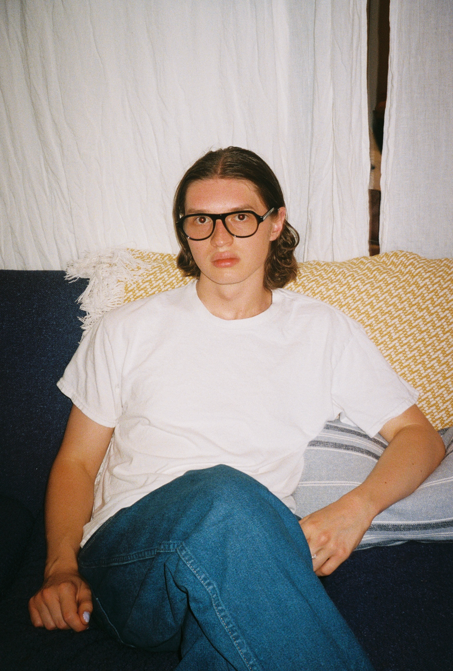 Man wearing SAD Eyewear Ash aviator rectangle glasses in black with clear blue light blocking protection lenses