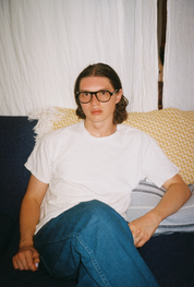 Man wearing SAD Eyewear Ash aviator rectangle glasses in black with clear blue light blocking protection lenses