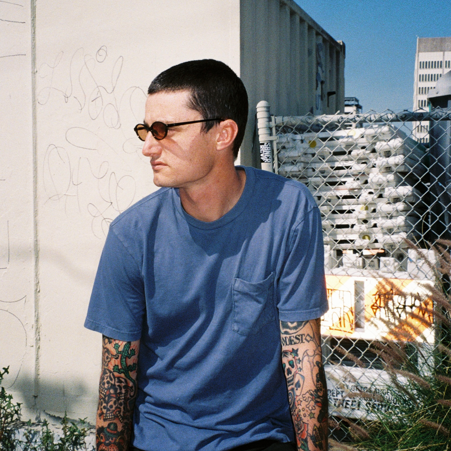 Zachary Kovacs wearing SAD Eyewear Celeste oval sunglasses in black with polarized bronze UV protection lenses