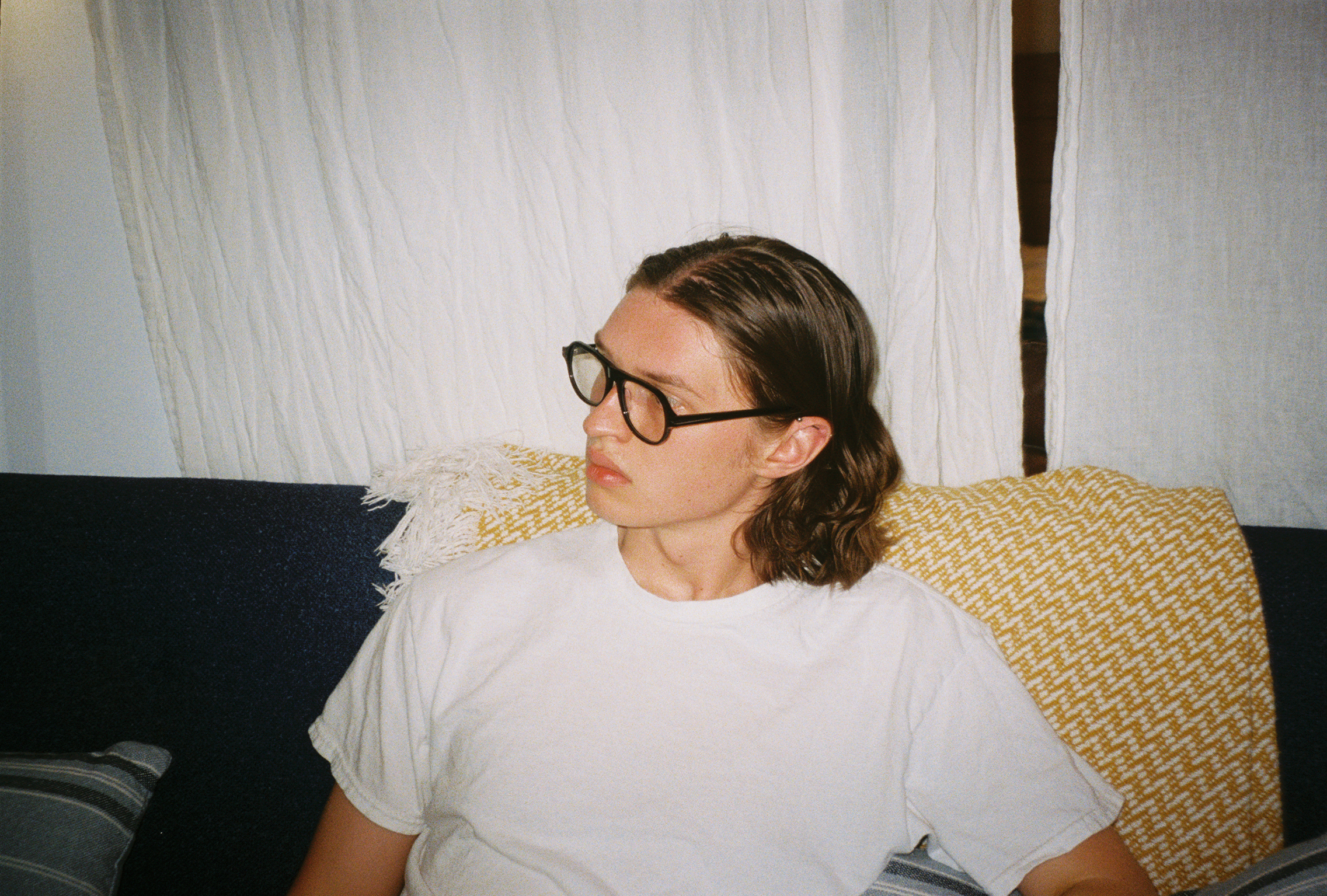 Man wearing SAD Eyewear Ash aviator rectangle glasses in black with clear blue light blocking protection lenses