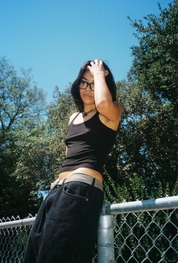 Woman wearing SAD Eyewear Dusk premium square glasses in black with clear blue light protection lenses