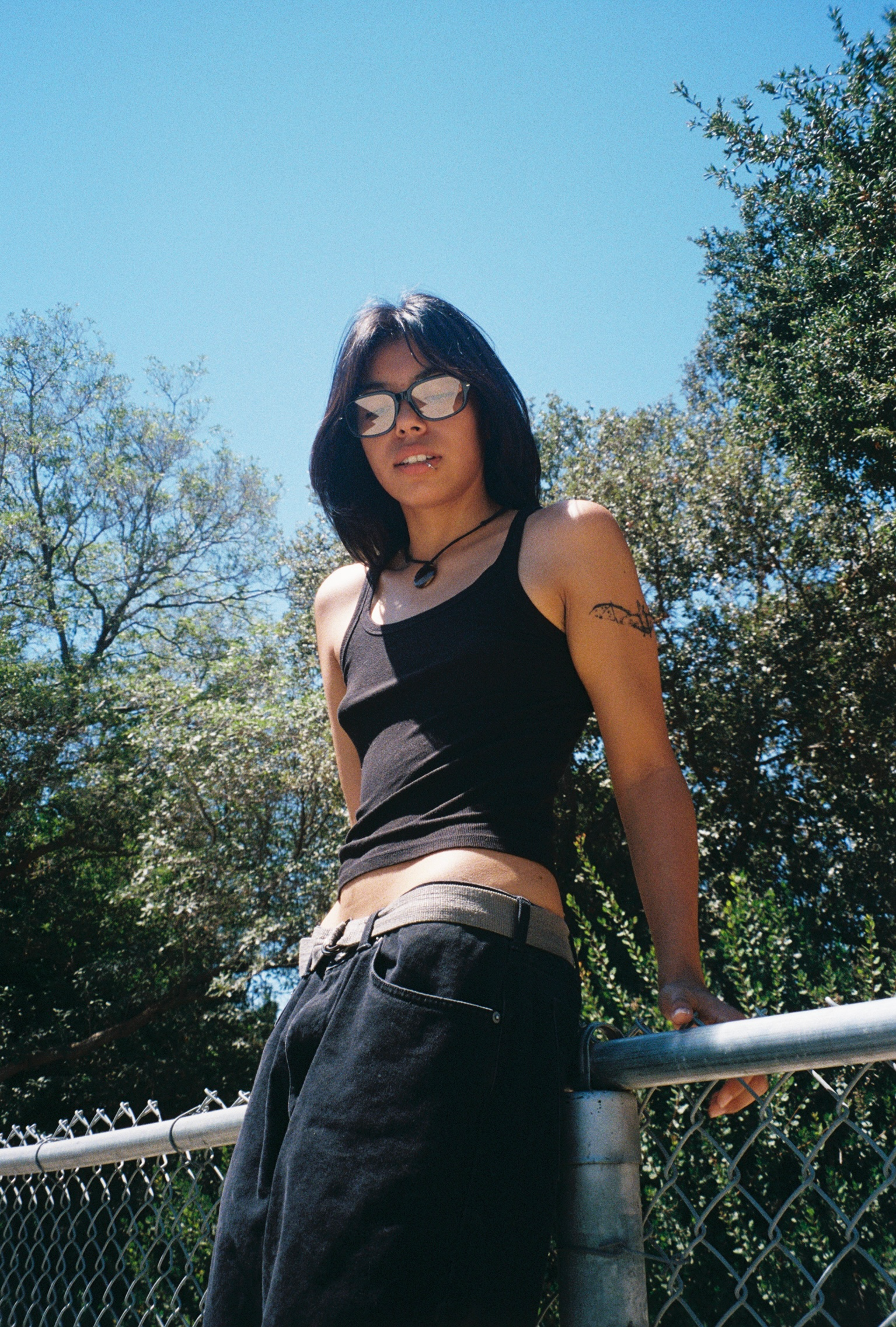 Woman wearing SAD Eyewear Dusk premium square glasses in black with clear blue light protection lenses