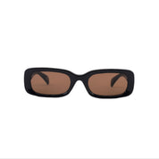 Black sunglasses with brown lenses on a white background