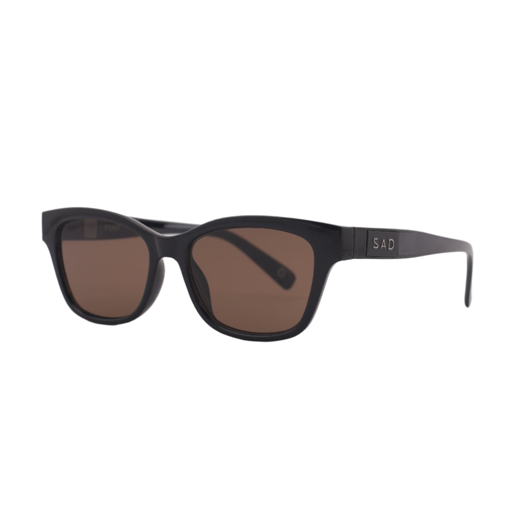 Black sunglasses with brown lenses on a light gray background