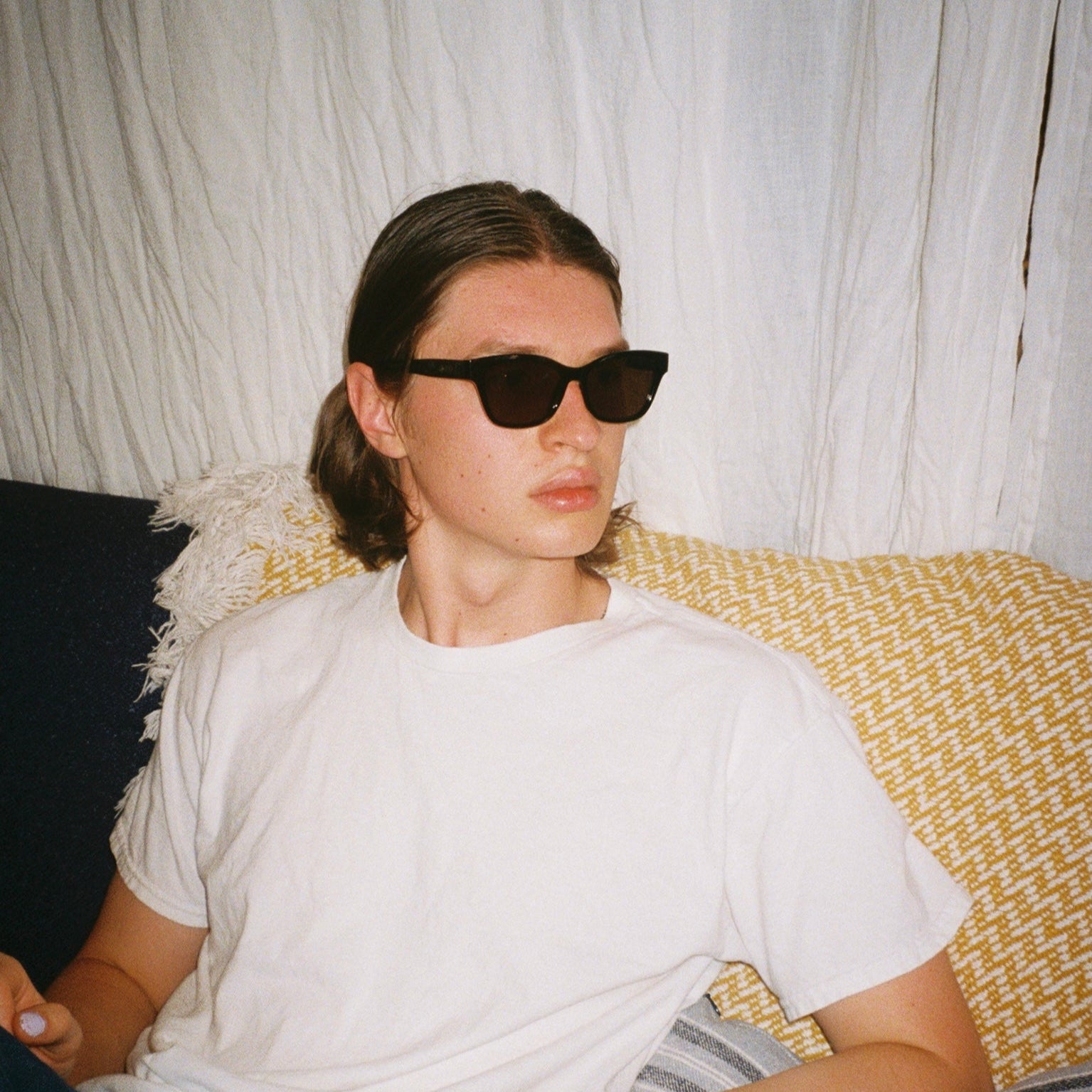 Man wearing SAD Eyewear Pony wayfarer rectangle sunglasses in black with UV protection lenses