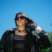Woman wearing SAD Eyewear Ash premium square sunglasses in black with polarized UV protection lenses