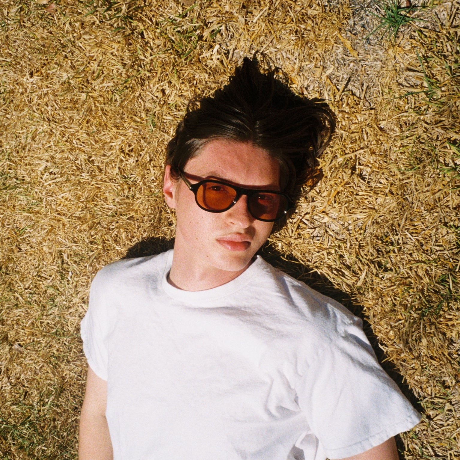 Man wearing SAD Eyewear Ash premium square sunglasses in black with tinted bronze UV protection lenses
