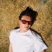 Man wearing SAD Eyewear Ash premium square sunglasses in black with tinted bronze UV protection lenses