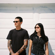 Macey Lemus and Zachary Kovacs wearing SAD Eyewear Celeste oval sunglasses in black with polarized grey UV protection lenses