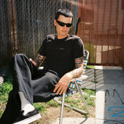 Zachary Kovacs wearing SAD Eyewear Fade wrap around sunglasses in black with polarized grey UV protection lenses