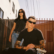 Macey Lemus and Zachary Kovacs wearing SAD Eyewear Fade wrap around sunglasses in black with polarized grey UV protection lenses