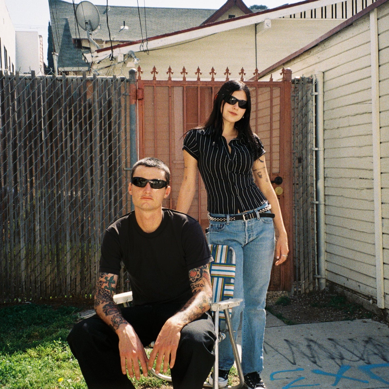 Macey Lemus and Zachary Kovacs wearing SAD Eyewear Fade wrap around sunglasses in black with polarized bronze UV protection lenses