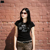 Macey Lemus wearing SAD Eyewear Celeste oval sunglasses in black with polarized bronze UV protection lenses