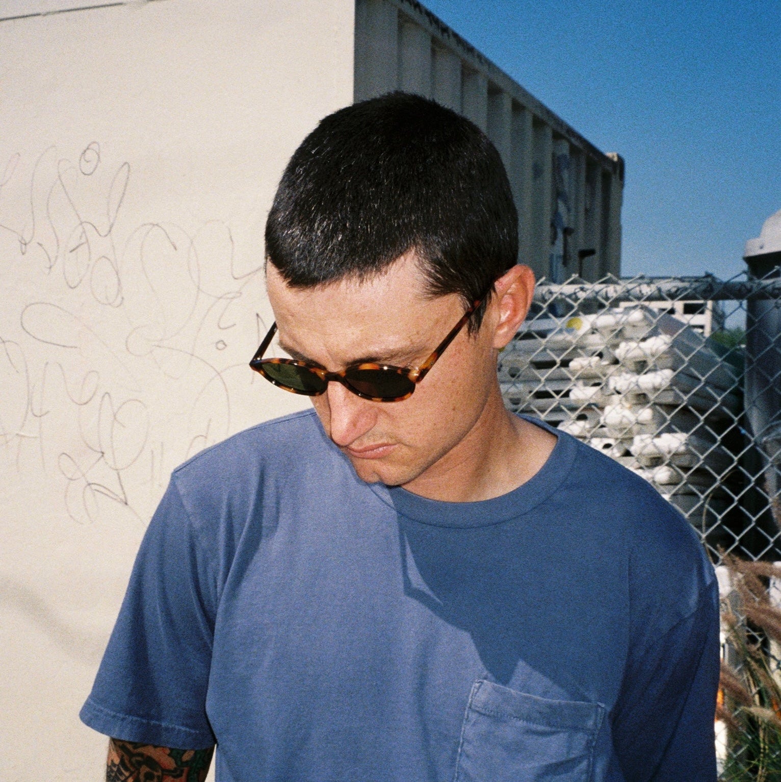 Zachary Kovacs wearing SAD Eyewear Celeste oval sunglasses in tortoise with polarized olive UV protection lenses