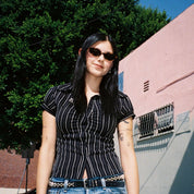 Macey Lemus wearing SAD Eyewear Celeste oval sunglasses in tortoise with polarized olive UV protection lenses