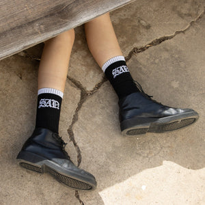 SAD Socks under a table