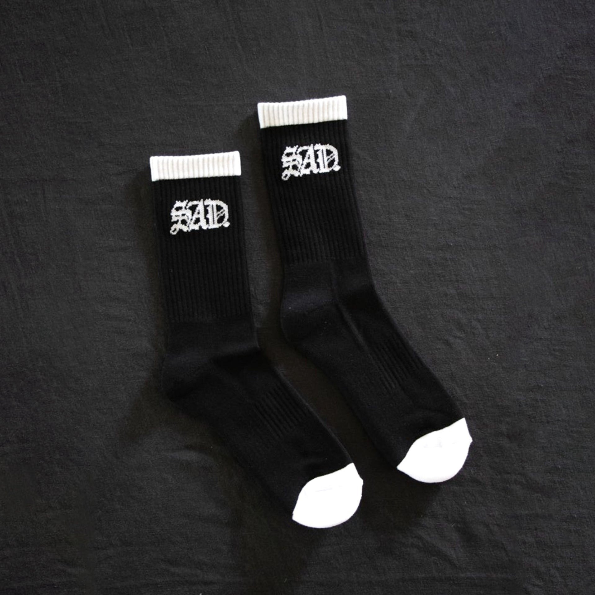 SAD Socks black backdrop 