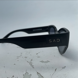 sad black facade side logo