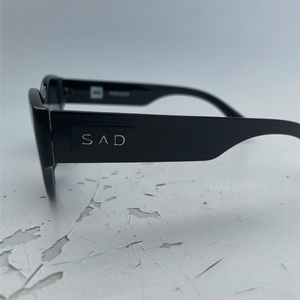 sad black facade side logo